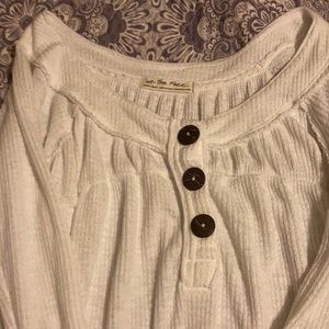 The size is XS- tight across the chest but flows at the bottom